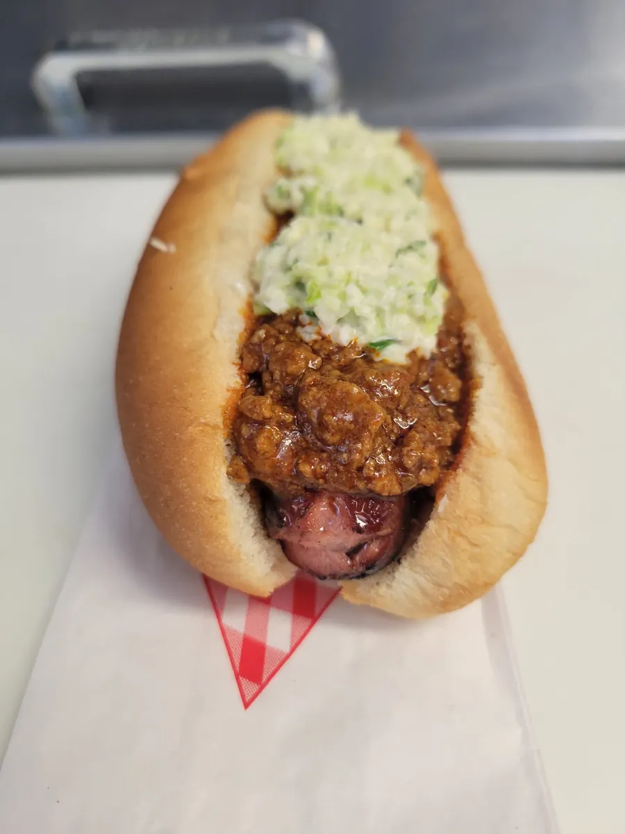 All-beef hot dog topped with chili and creamy slaw